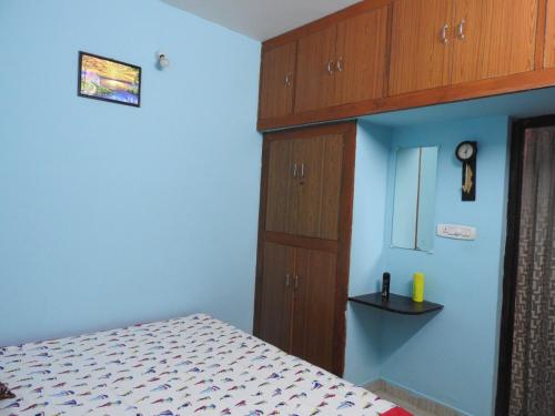 Postel nebo postele na pokoji v ubytování Shanthi Villa