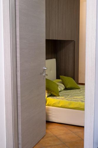 a bedroom with a bed with a mirror at La casa sotto le cascate Lago Maggiore - IXIHOME in Cittiglio