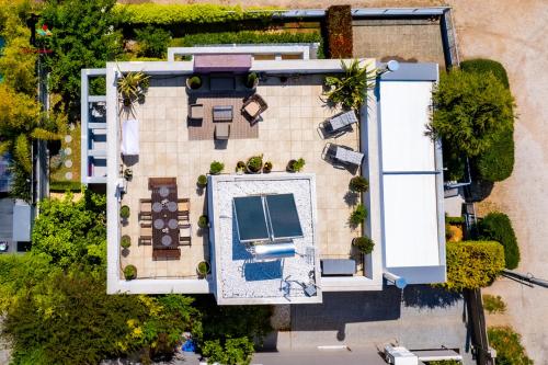 an overhead view of a house with a swimming pool at Donna's Family Residence in Porto Rafti