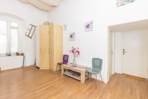 a living room with a table and two chairs at Heart of Dubrovnik Old Town apartments in Dubrovnik