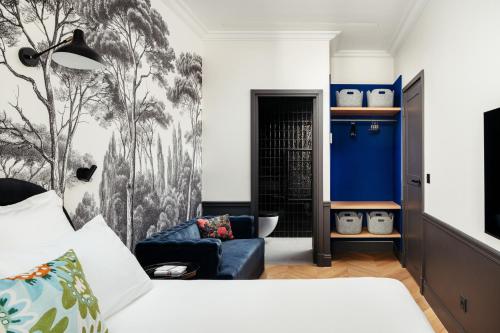 Ένα ή περισσότερα κρεβάτια σε δωμάτιο στο My Maison In Paris Invalides