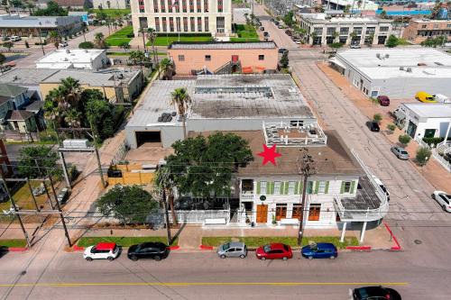 an aerial view of a building in a city at Sugar's INN Room #6 King Bed in Galveston