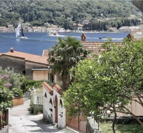 a house with a view of a body of water at Apartment Danja in Kamenari