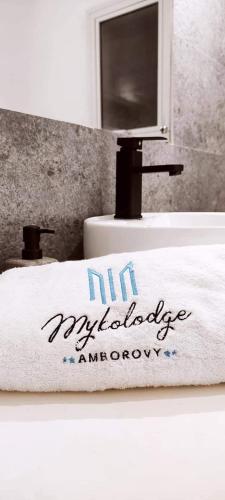 a towel on a sink in a bathroom at Mykolodge Majunga in Amborovy