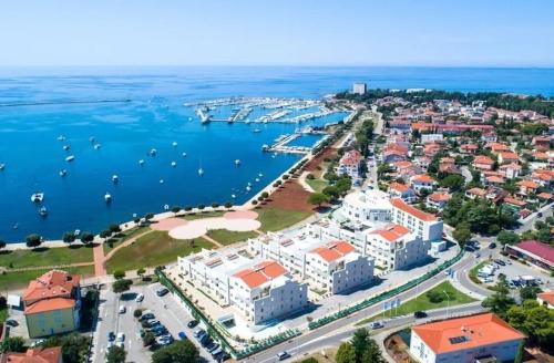 an aerial view of a city with a harbor at Supreme Studio Apartment Bijoux in Umag