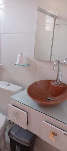 a bathroom with a sink and a toilet at A Casa Morro do Moreno in Vila Velha