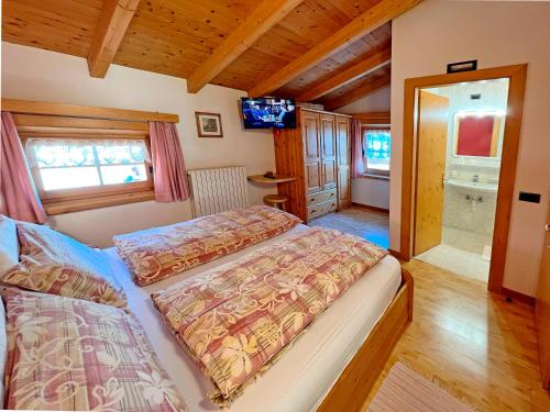 Postel nebo postele na pokoji v ubytování Garni Francescato