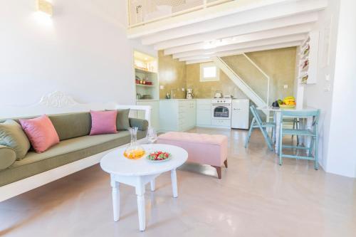 a living room with a couch and a table at LA CASA DI MARCONI in Symi