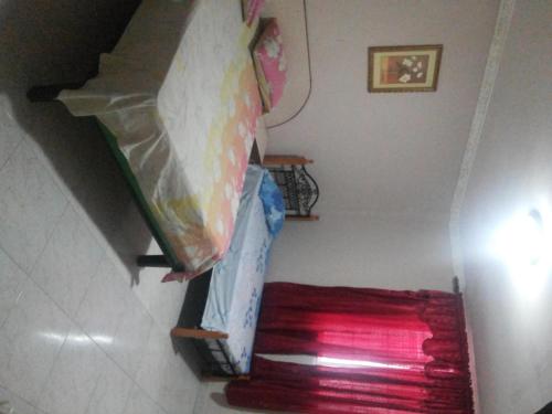 a staircase with a bed and a red carpet at Residencial Turistico Cuba in Panama City