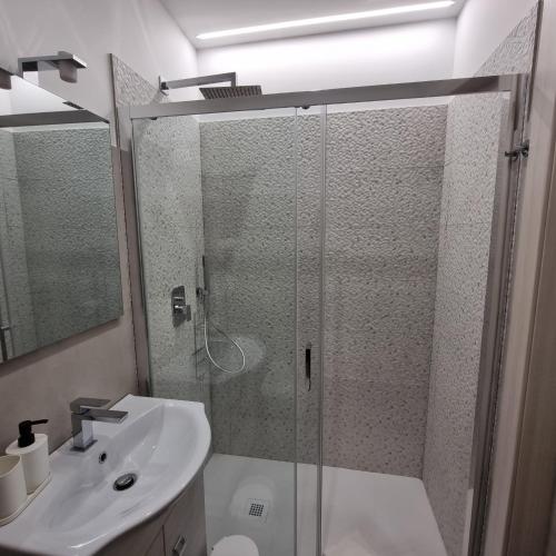 a bathroom with a shower and a sink at La Peonia B&B in Ragusa