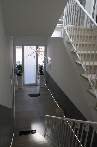 a staircase in a building with potted plants at La Peonia B&B in Ragusa