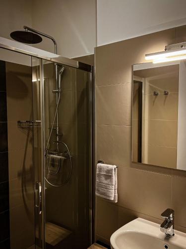 a bathroom with a shower and a sink and a mirror at Borna and Franko Rooms Split city centre in Split