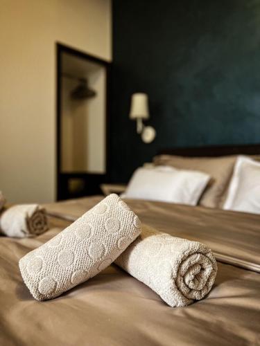 a towel laying on top of a bed at Borna and Franko Rooms Split city centre in Split