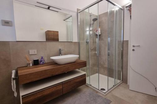 a bathroom with a sink and a shower at Villa Katy in Tormine