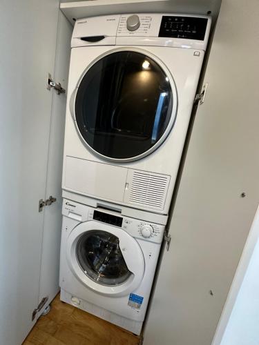 a washer and dryer in a small room at Vitosha Terrace 1BR Apartment with Parking in Sofia