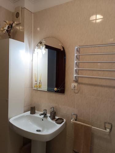 a bathroom with a sink and a mirror at Apartamento Solzende in Esposende