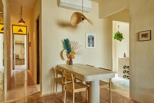 a dining room with a table and chairs at APT by DW in San Juan