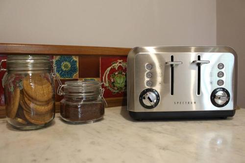 a toaster and a toaster sitting on a counter at Boutique double room with countryside views in Wilby