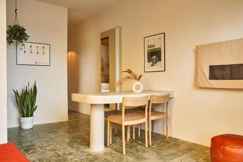 a dining room with a table and chairs at APT by DW in San Juan