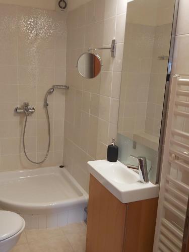 a bathroom with a sink and a shower and a toilet at Villa Marilena in Nafpaktos