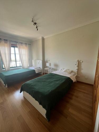 מיטה או מיטות בחדר ב-HigH Cascais