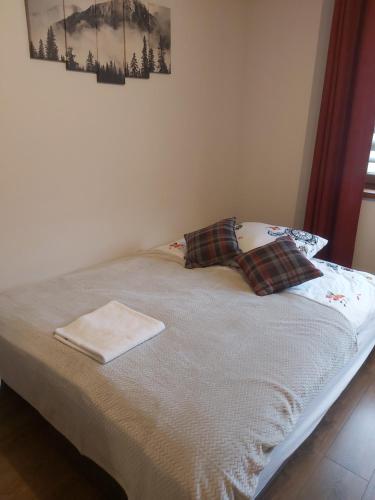 Łóżko lub łóżka w pokoju w obiekcie Dębowy Apartamenty/Pokoje