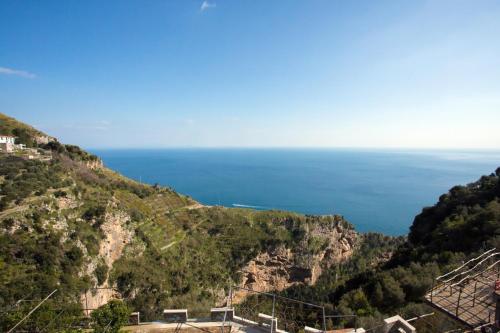 a view of the ocean from a mountain at Fico D'India Relais in Furore