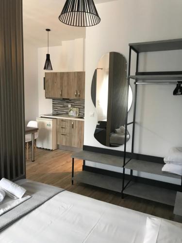 a bedroom with a bunk bed and a mirror at Savvas House in Neos Marmaras