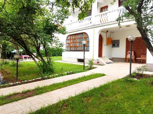 a building with a walkway in front of it at Vila Gardenia in Sarajevo