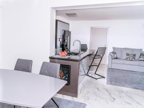 a living room with a fireplace and a couch at Villa Palma Krk in Krk