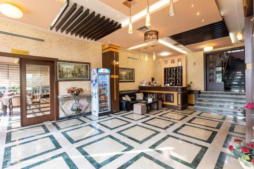 a lobby of a restaurant with a vending machine at Prince Hotel in Tirana