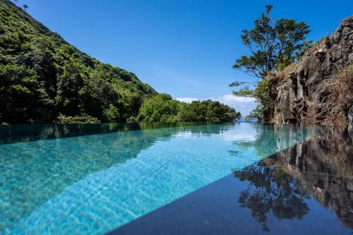 a river in the middle of a mountain at Terrabona Nature & Vineyards in Boaventura