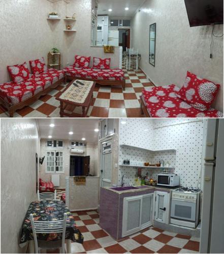 a kitchen and a living room with red furniture at residhome in Sétif