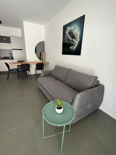 a living room with a couch and a table at SeaCity Vibes Apartments in Monopoli