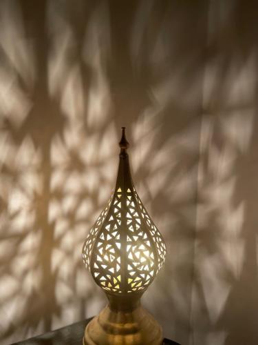 a lamp sitting on top of a table at Riad Hanya in Marrakech