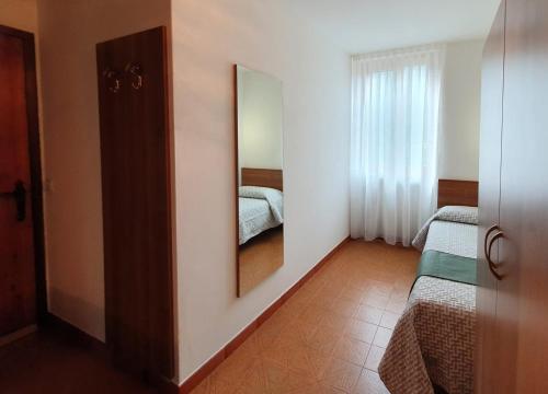 Una cama o camas en una habitación de Altavilla Albergo meublé