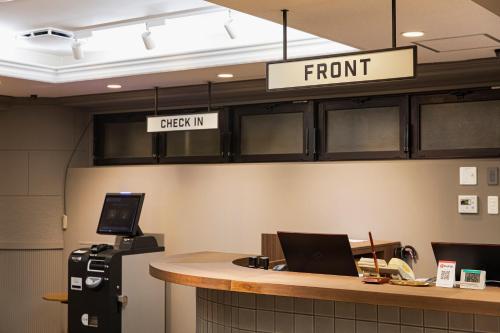 an office with a front desk and a sign that readserror at Hotel Arthur KITAHAMA BASE in Beppu