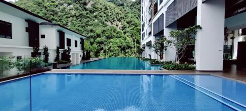 an empty swimming pool in the middle of a building at H&W Sunway Onsen Suites Services Tambun Ipoh S-07-05 in Ipoh