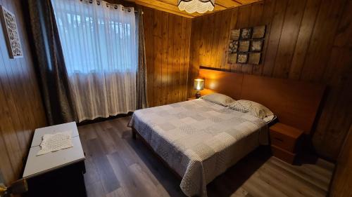 En eller flere senge i et værelse på Cottages at Katawoda