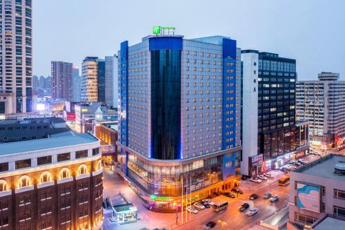 a view of a large building in a city at Holiday Inn Express City Centre Dalian by IHG in Dalian