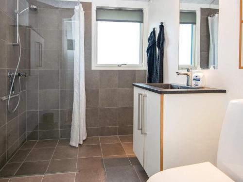 a bathroom with a shower and a sink at 5 person holiday home in Aabenraa-By Traum in Aabenraa