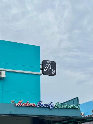a sign on the side of a building at Hotel Premier Inn (Prima Square) in Sandakan