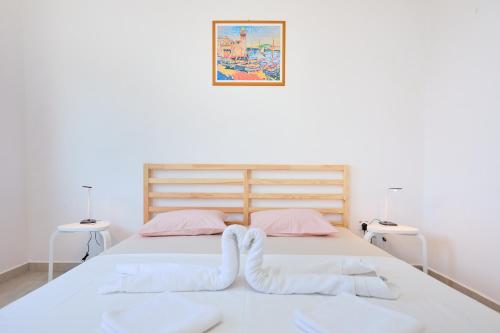 Ένα ή περισσότερα κρεβάτια σε δωμάτιο στο Apartmets Sutmiholjska