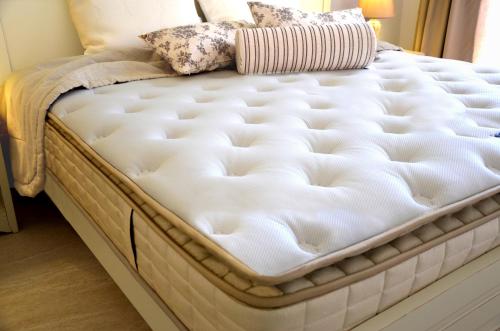 a mattress sitting on a bed in a room at Agrimia Holiday Apartments in Plataniás