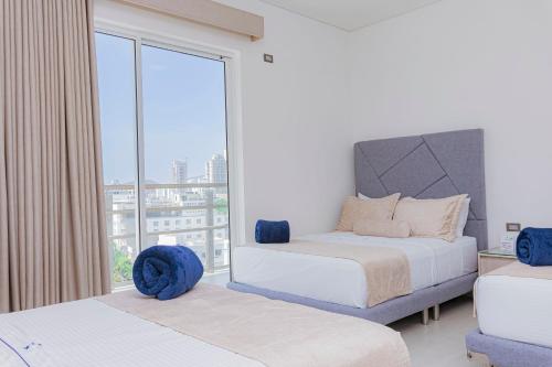Una cama o camas en una habitación de Hotel Marco Polo Rodadero