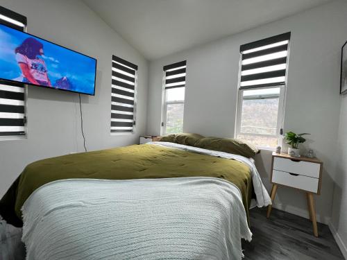 Ένα ή περισσότερα κρεβάτια σε δωμάτιο στο Lirios Tiny House en Valle de Guadalupe