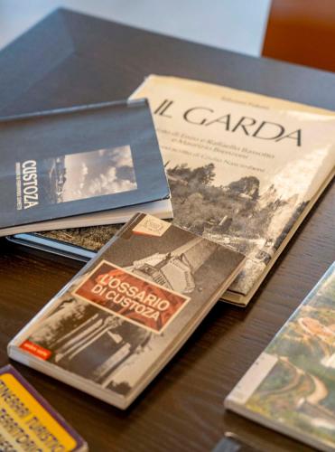 a group of books sitting on top of a table at RipassoQui in Custoza