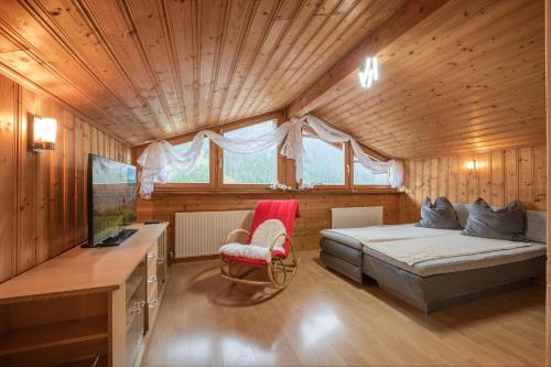 a bedroom with a bed and a desk in a room at Pension Steinadler in Neustift im Stubaital