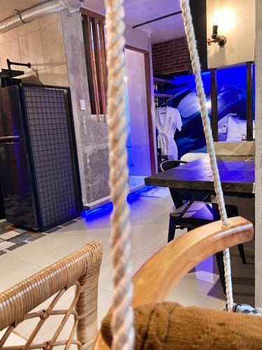 a room with ropes and a room with beds at CLOCKWORKORANGE Luxury Suites 4-Minutes Away To Airport in Mactan
