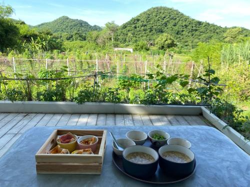 a tray of food sitting on top of a table at Royal mountain view (วิวเขาหลวง) in Ratchaburi